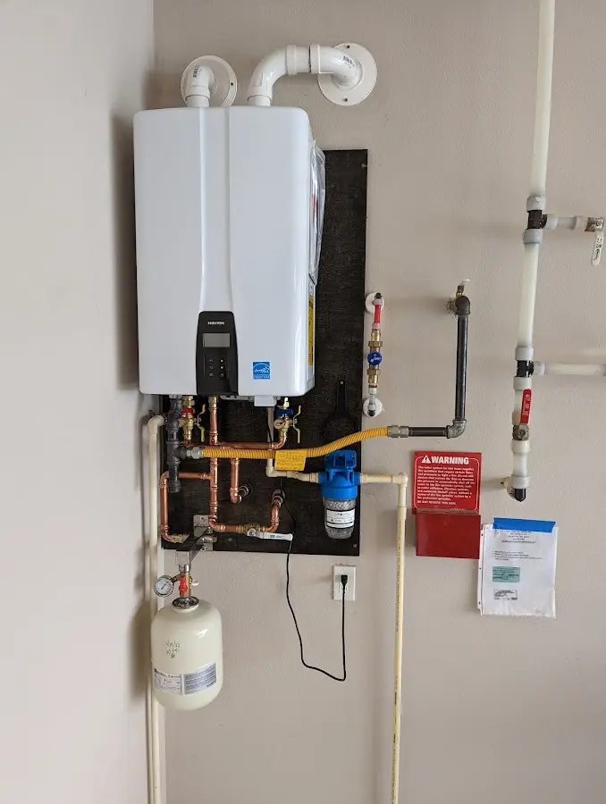 Professional plumber installing copper piping in a Plattsmouth home